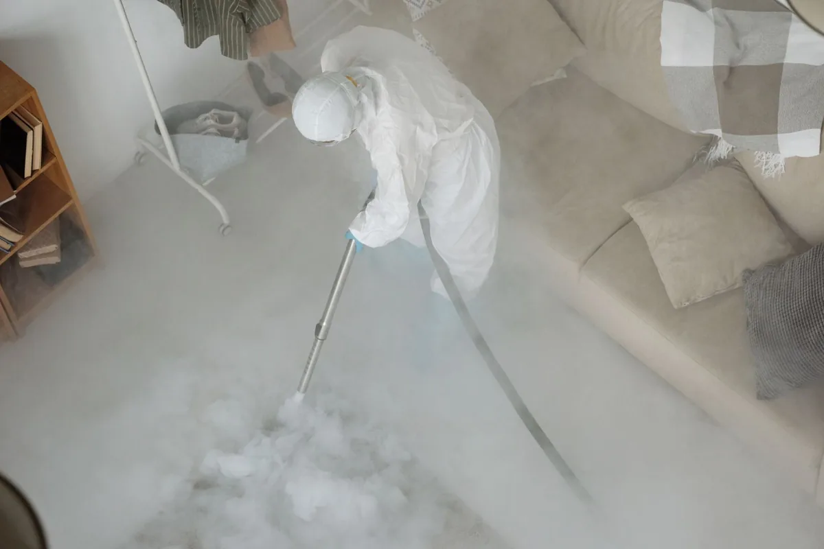 Biohazard cleanup technician in protective equipment, Charlestown, RI